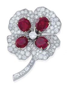 Lot 231 - A RUBY AND DIAMOND 'TRÈFLE À QUATRE FEUILLES' BROOCH, BY BOUCHERON