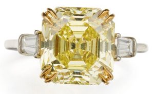 LOT 128 - FANCY INTENSE YELLOW DIAMOND AND DIAMOND RING